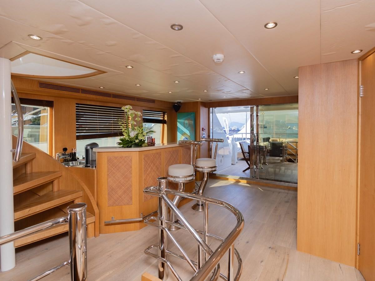 a room with a table and chairs aboard BANDIDO I Yacht for Sale