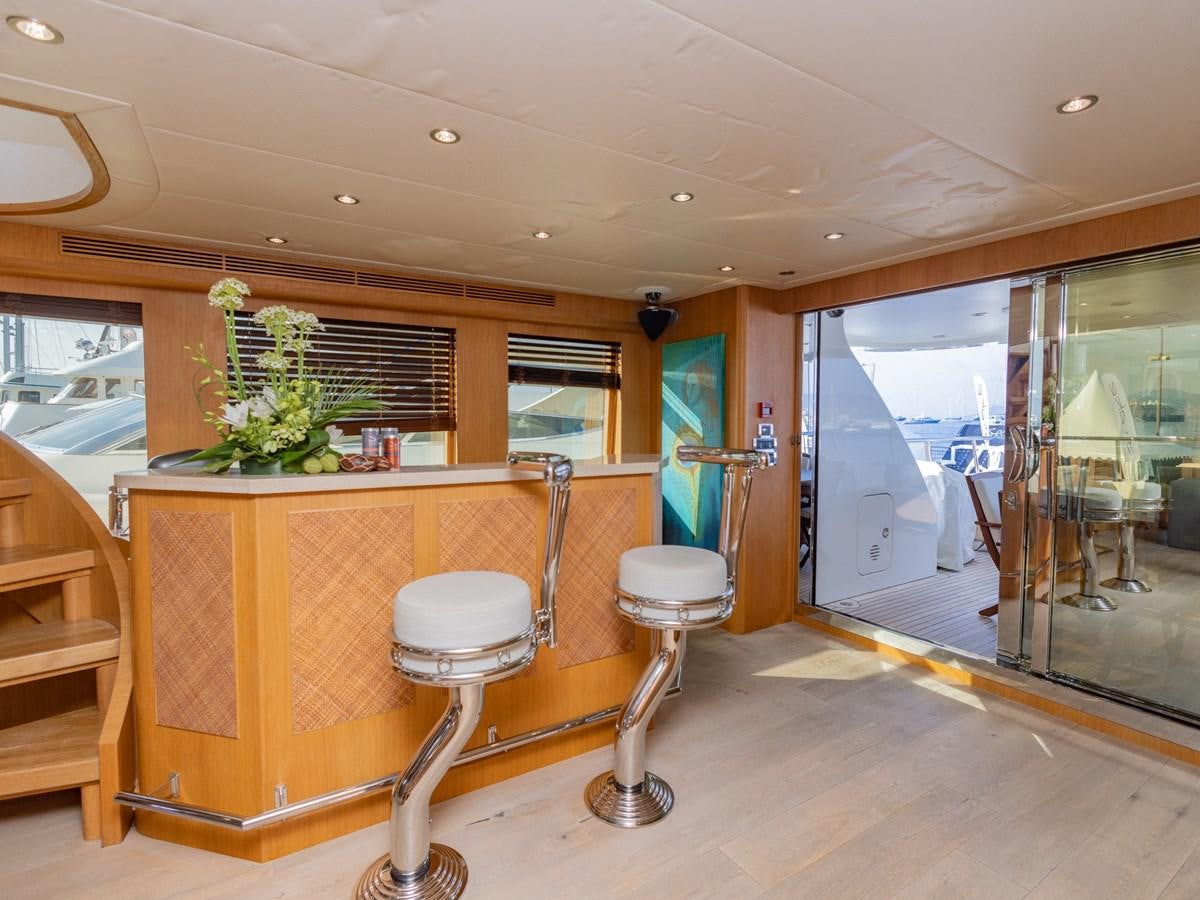 a room with a desk and chairs aboard BANDIDO I Yacht for Sale
