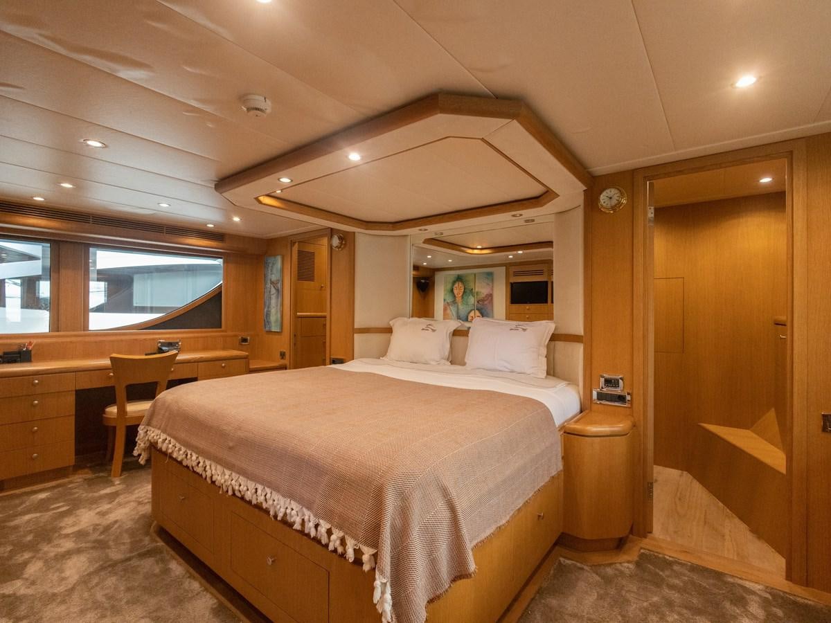 a large bedroom with a large bed aboard BANDIDO I Yacht for Sale