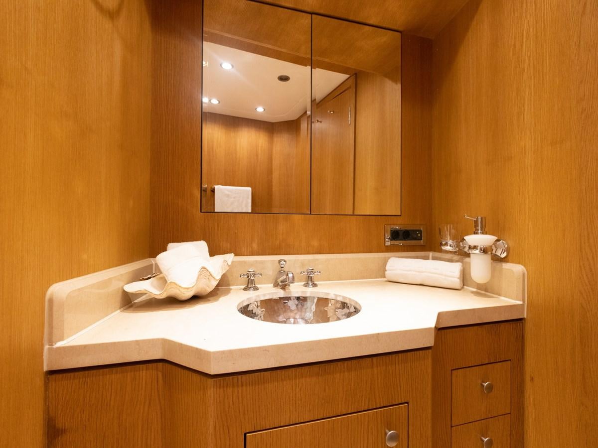a bathroom with a large mirror aboard BANDIDO I Yacht for Sale