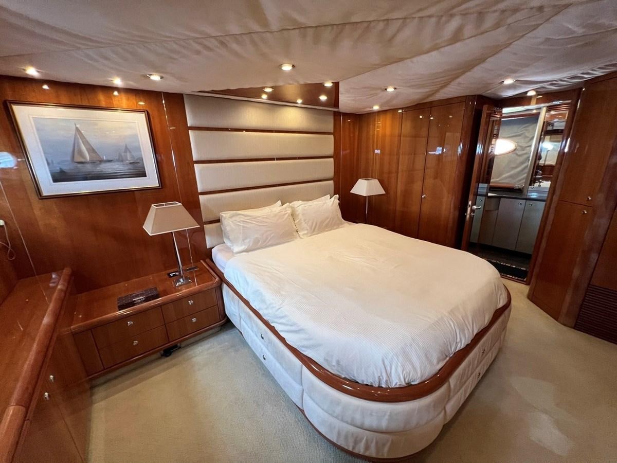 a bed in a hotel room aboard SUNSEEKER 95 PREDATOR Yacht for Sale