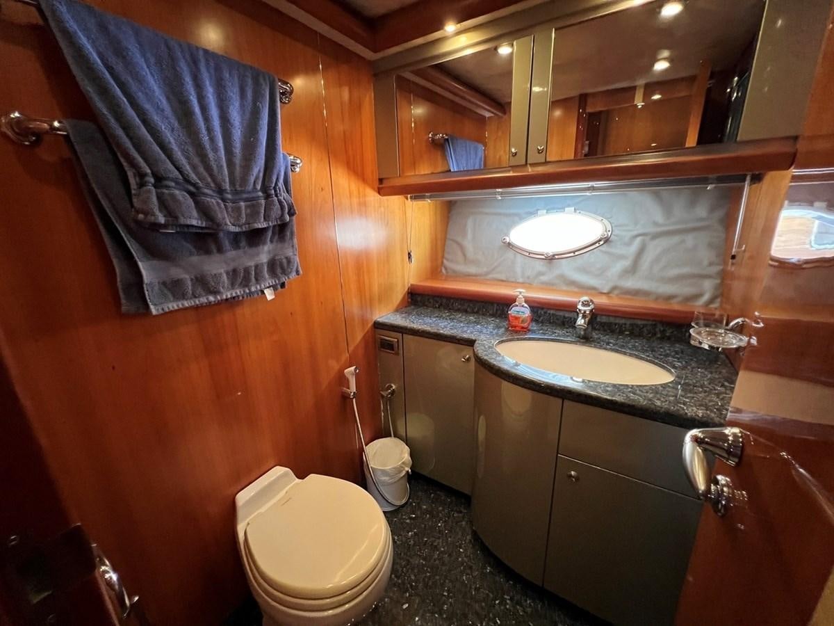 a bathroom with a sink and toilet aboard SUNSEEKER 95 PREDATOR Yacht for Sale