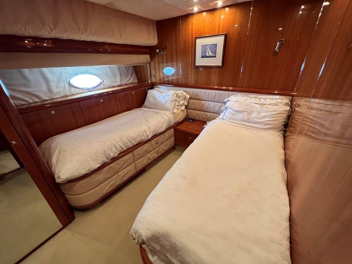 a room with a bed and a couch aboard SUNSEEKER 95 PREDATOR Yacht for Sale