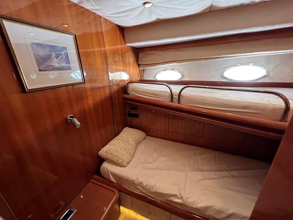 a room with wooden furniture aboard SUNSEEKER 95 PREDATOR Yacht for Sale