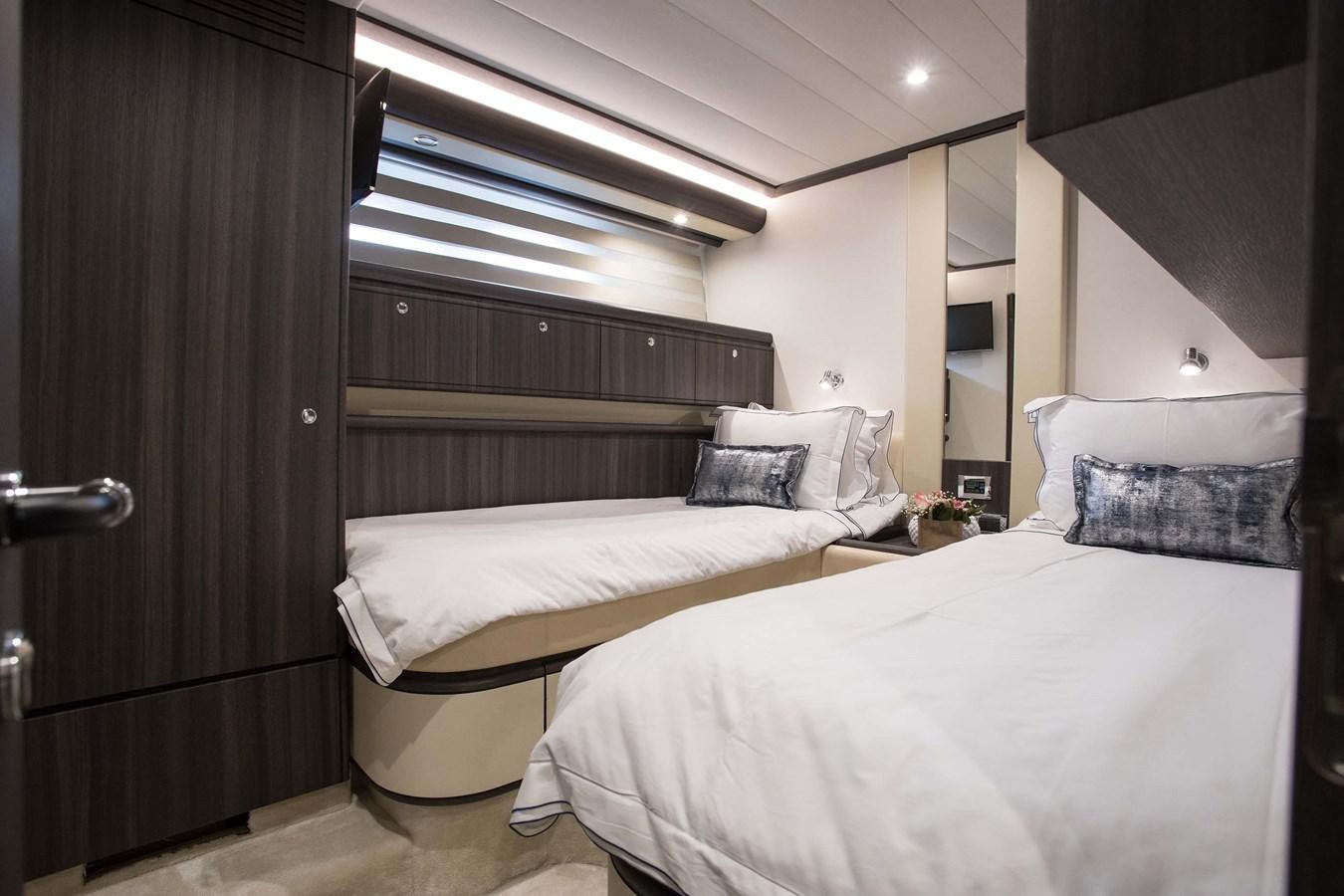a room with two beds aboard SOFIA D Yacht for Sale