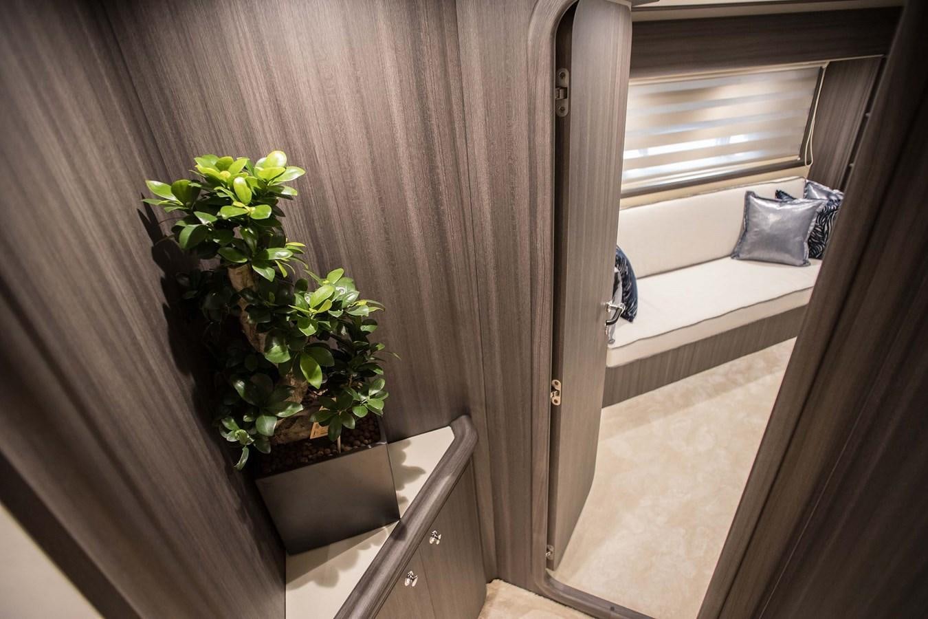 a plant in a pot on a table aboard SOFIA D Yacht for Sale