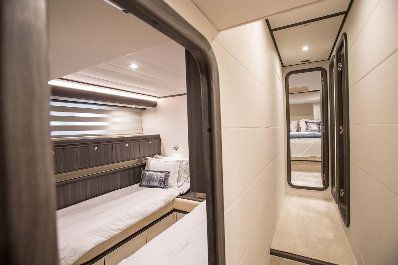 a room with a bed and a mirror aboard SOFIA D Yacht for Sale