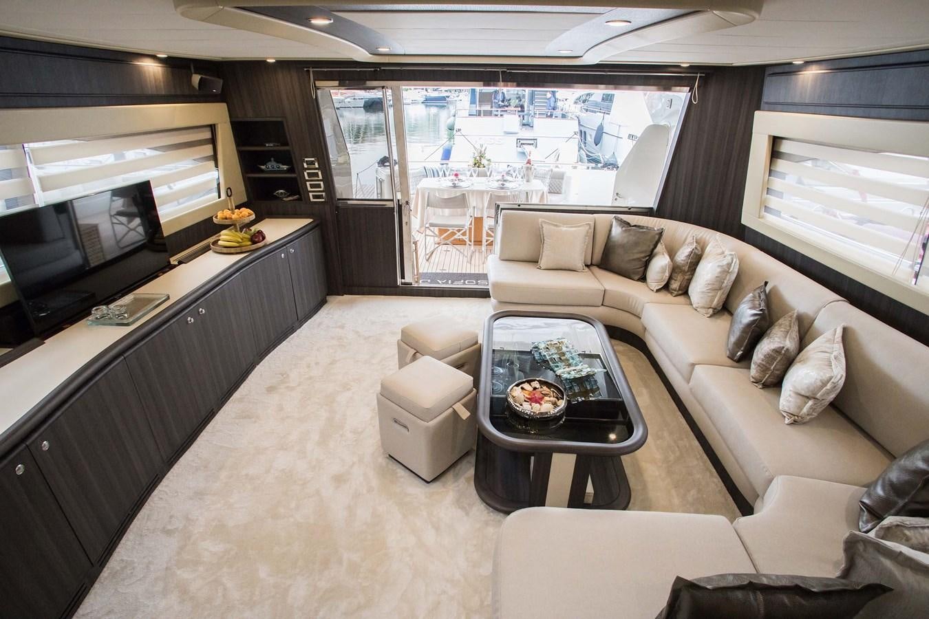 a living room with a large window aboard SOFIA D Yacht for Sale