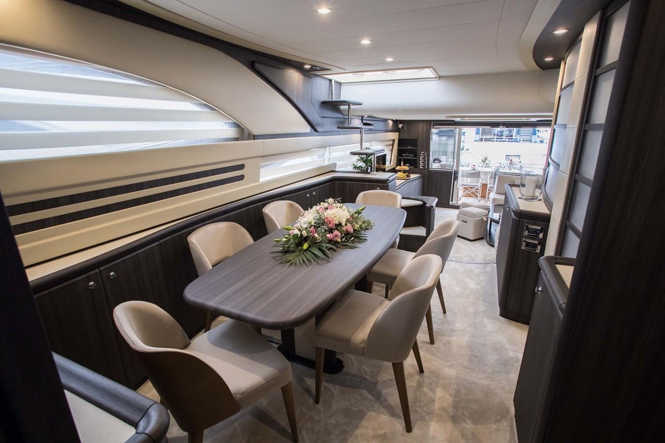 a room with tables and chairs aboard SOFIA D Yacht for Sale