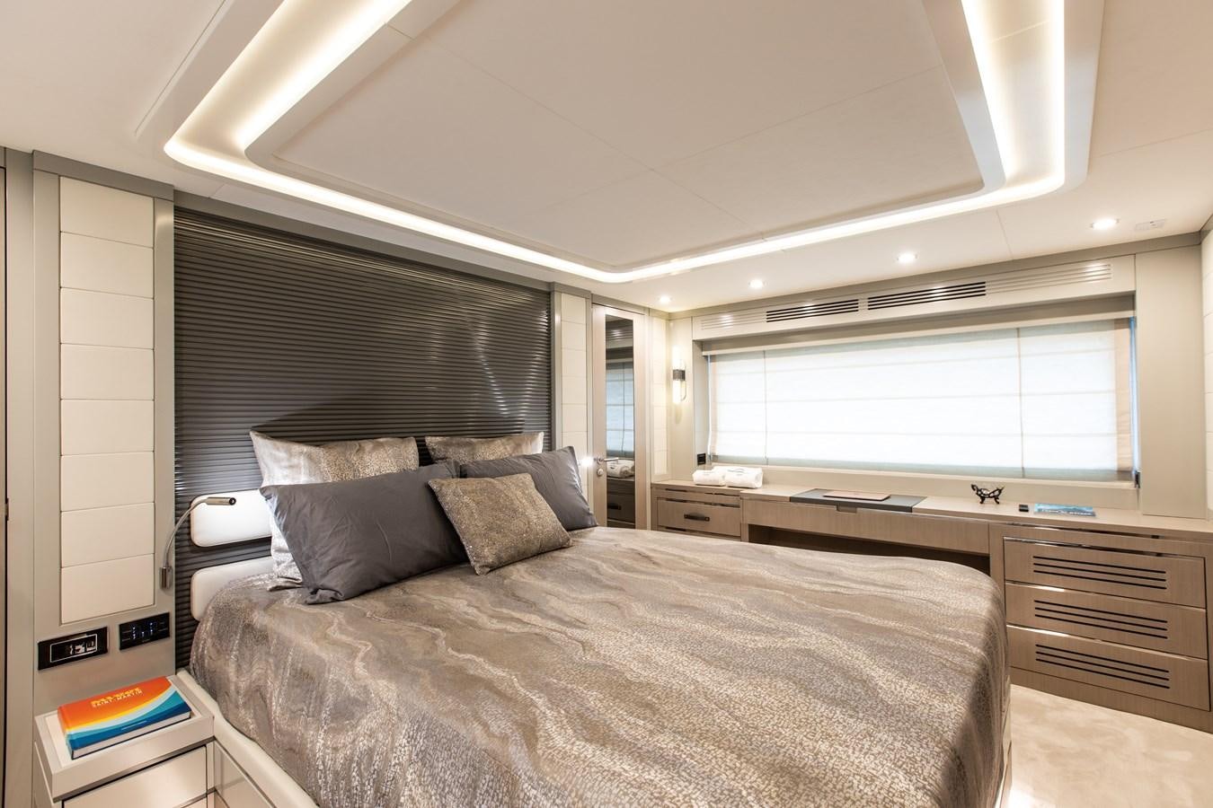 a bedroom with a large bed aboard MY LADY Y Yacht for Sale