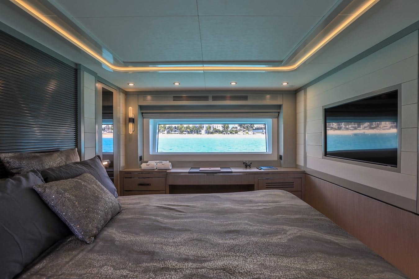 a bed with a large screen aboard MY LADY Y Yacht for Sale