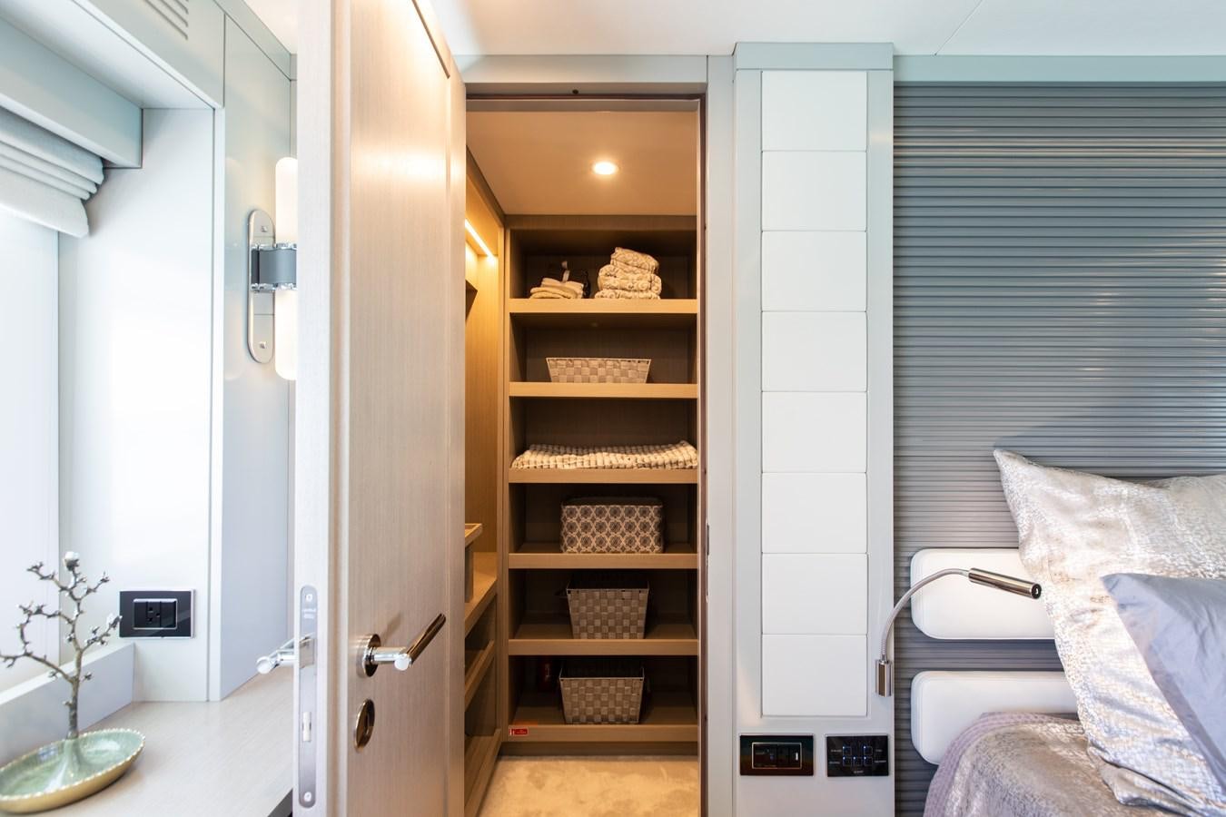 a room with a closet and a bed aboard MY LADY Y Yacht for Sale