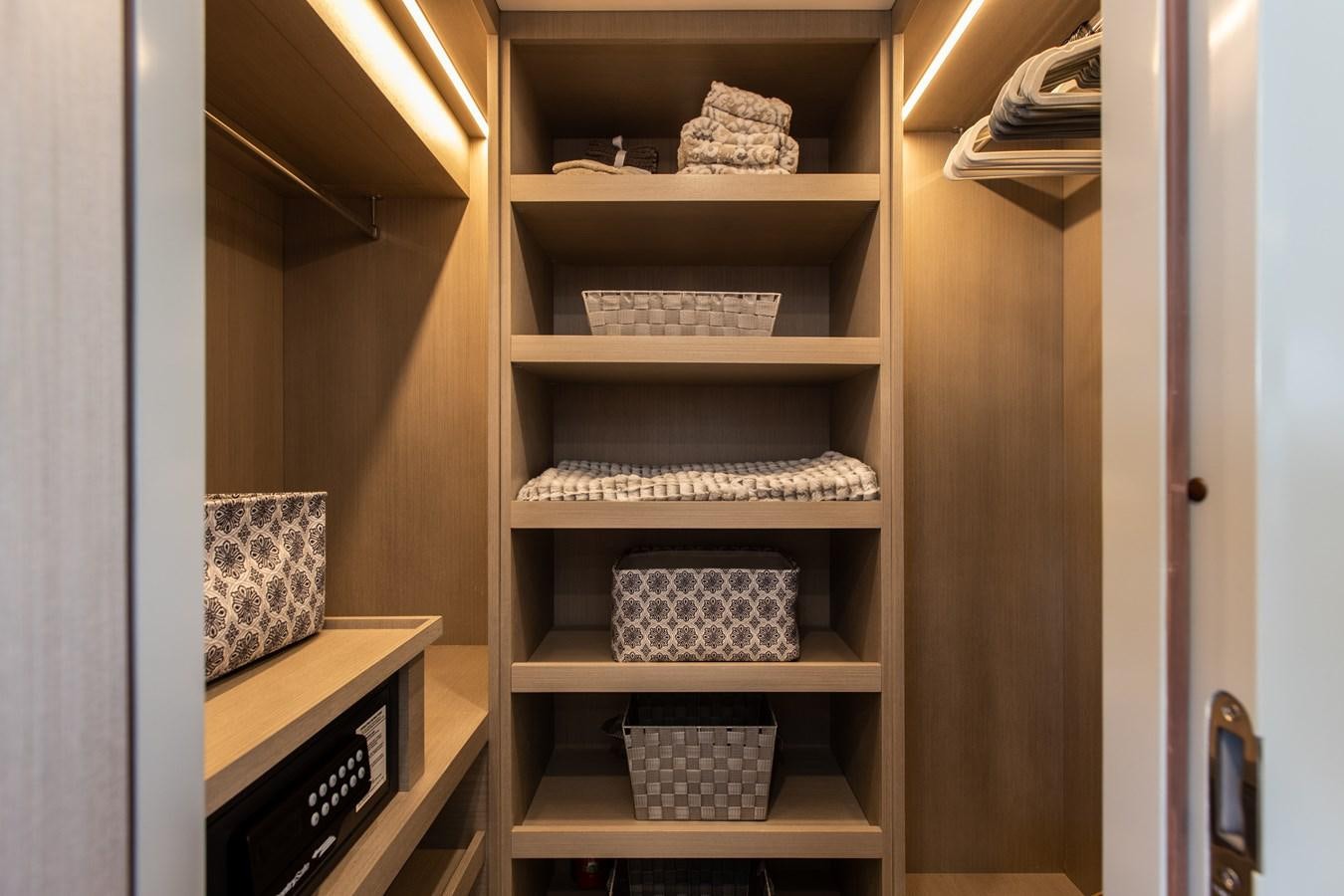 a white shelf with a book on it aboard MY LADY Y Yacht for Sale