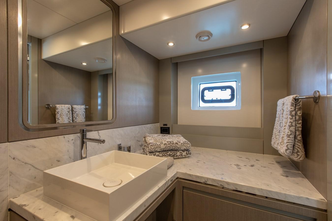 a bathroom with a large mirror aboard MY LADY Y Yacht for Sale