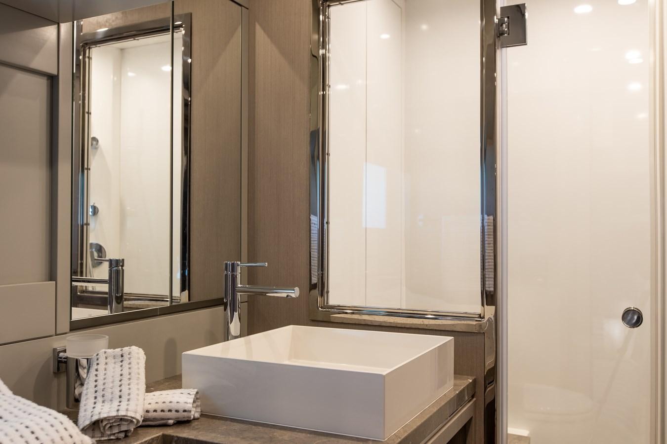 a bathroom with a large mirror aboard MY LADY Y Yacht for Sale