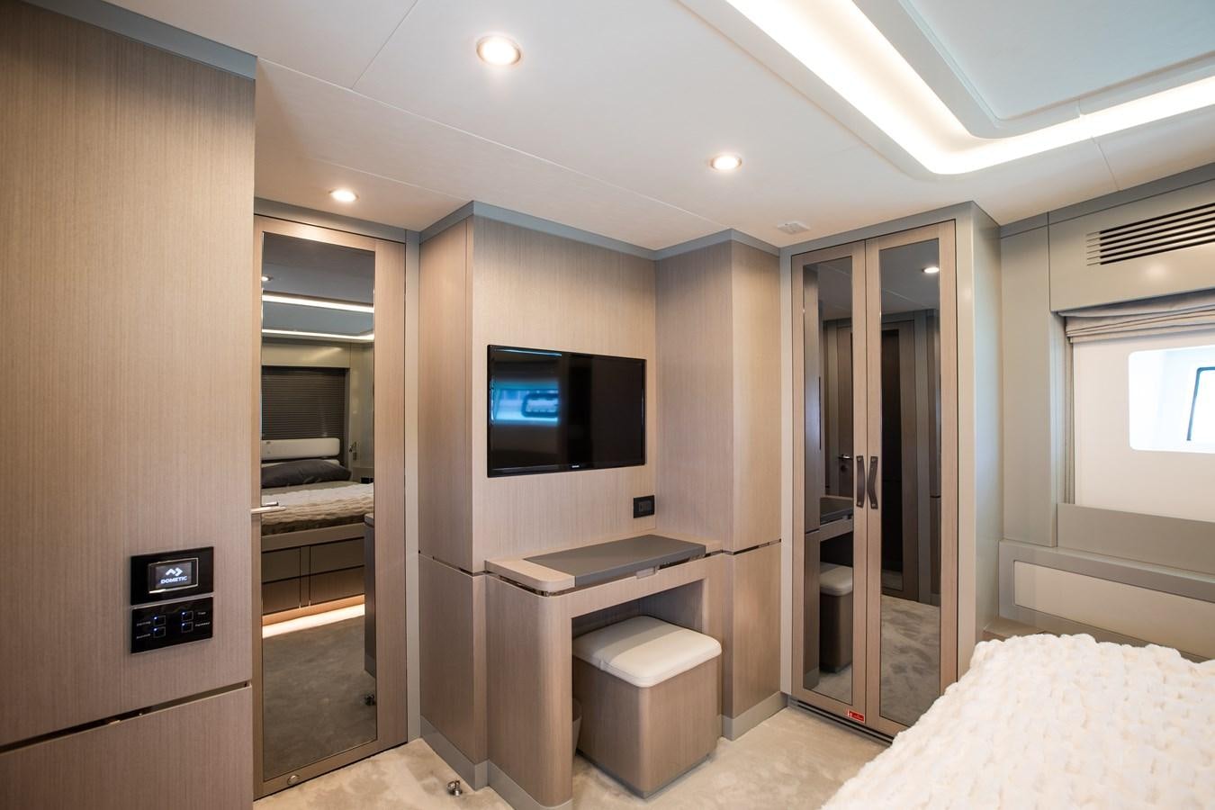 a hotel room with a bed and tv aboard MY LADY Y Yacht for Sale