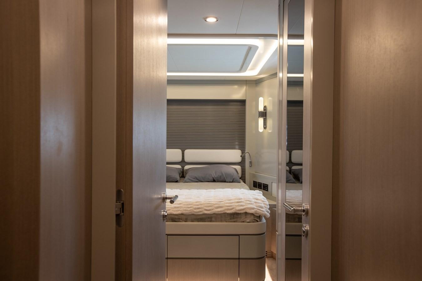 a room with a bed and a door aboard MY LADY Y Yacht for Sale