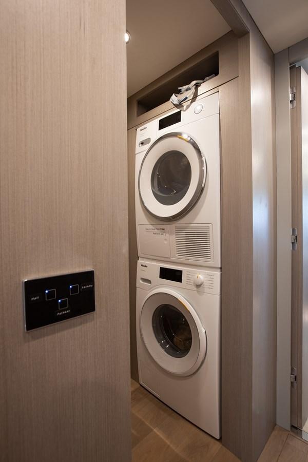 a washer and dryer in a room aboard MY LADY Y Yacht for Sale