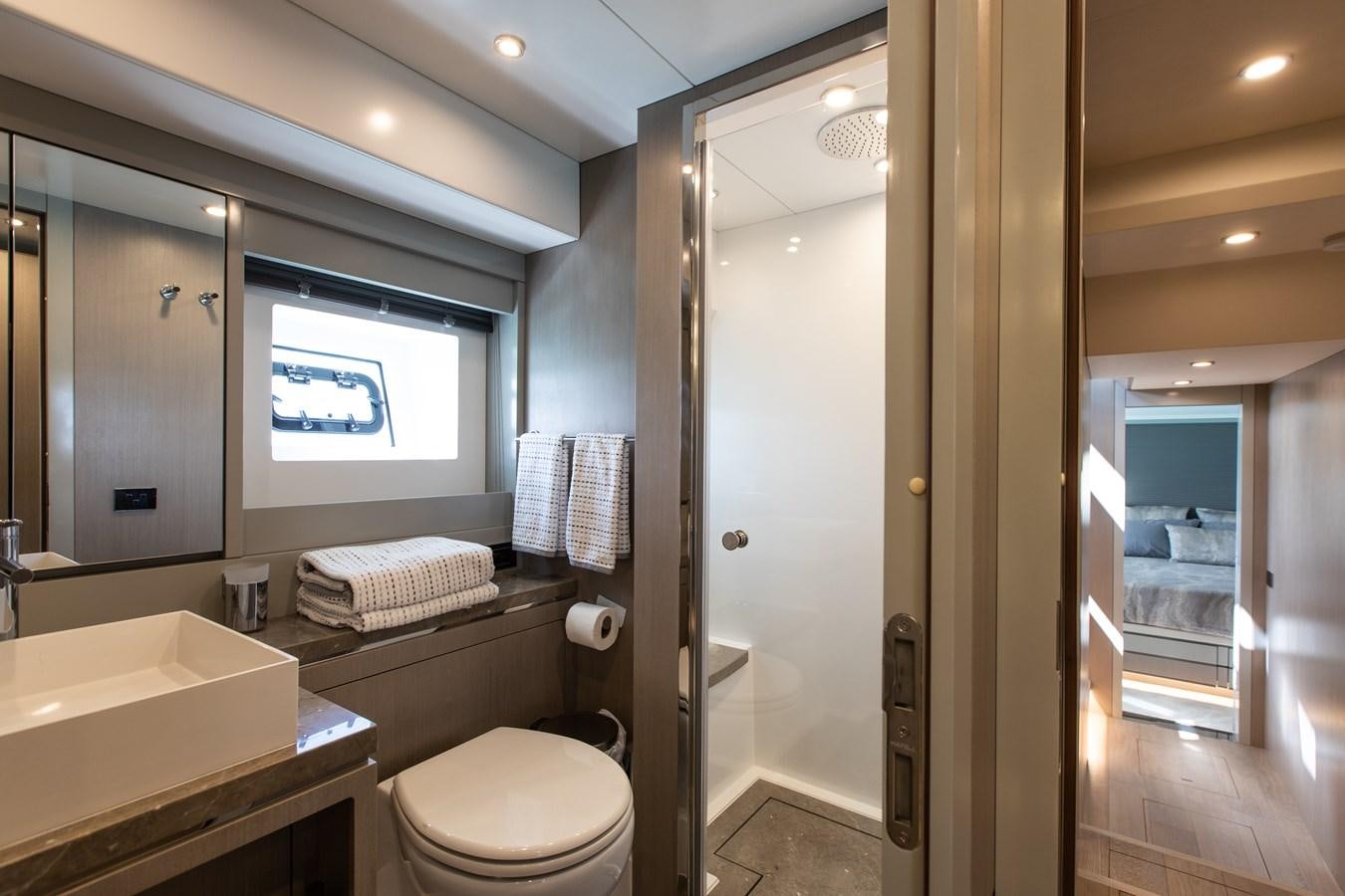 a bathroom with a glass shower aboard MY LADY Y Yacht for Sale