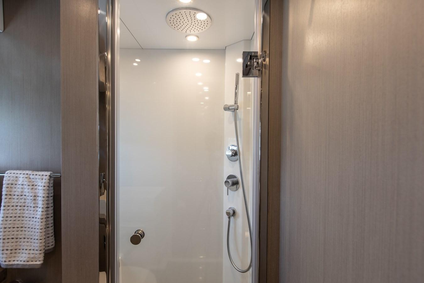 a shower with a towel on the wall aboard MY LADY Y Yacht for Sale