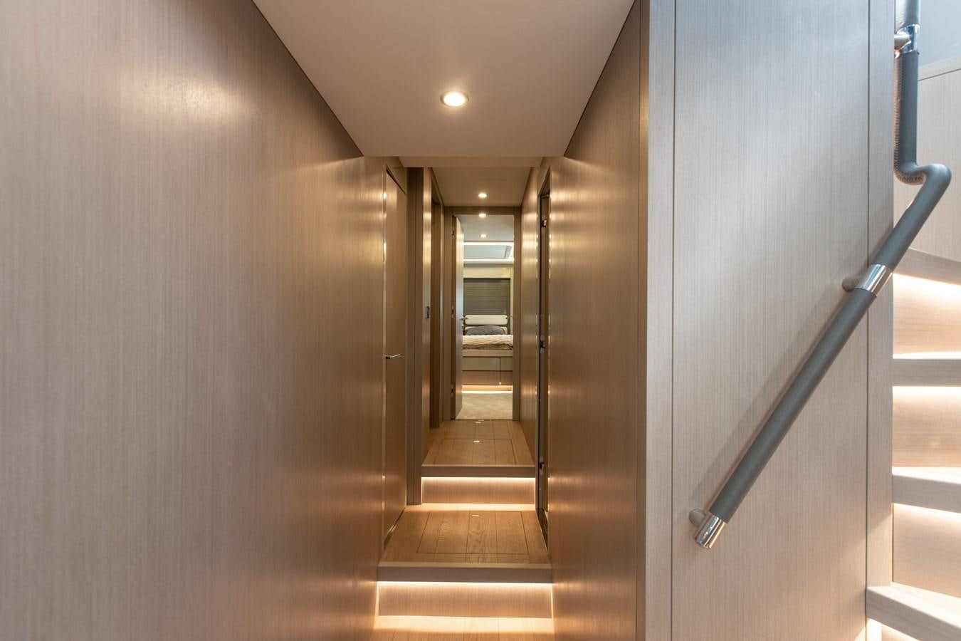 a hallway with a metal railing aboard MY LADY Y Yacht for Sale