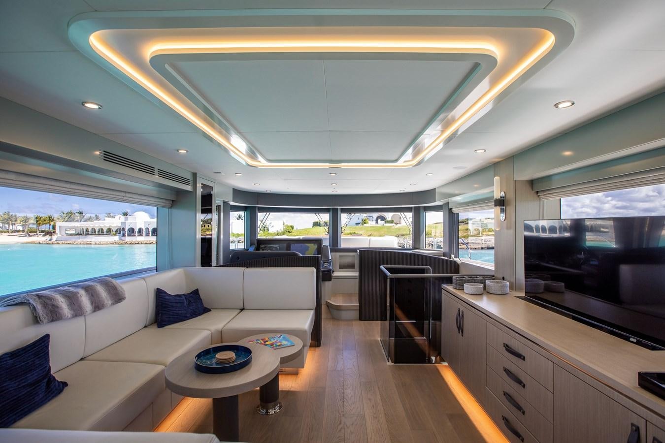 a living room with a large window aboard MY LADY Y Yacht for Sale