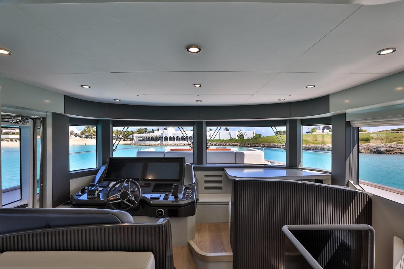 inside of a building with a large window and a pool aboard MY LADY Y Yacht for Sale