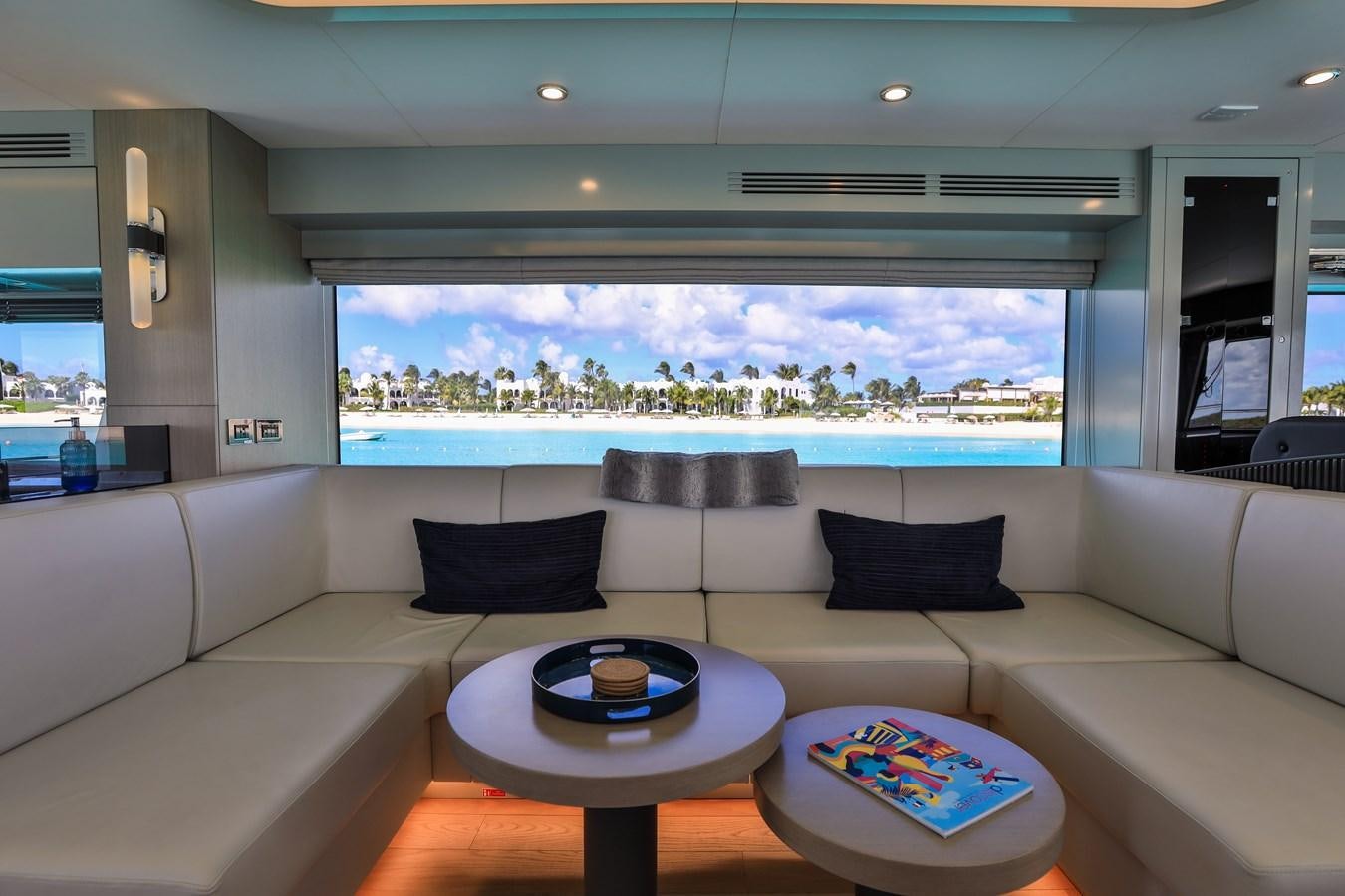 a white couch with a table on it aboard MY LADY Y Yacht for Sale