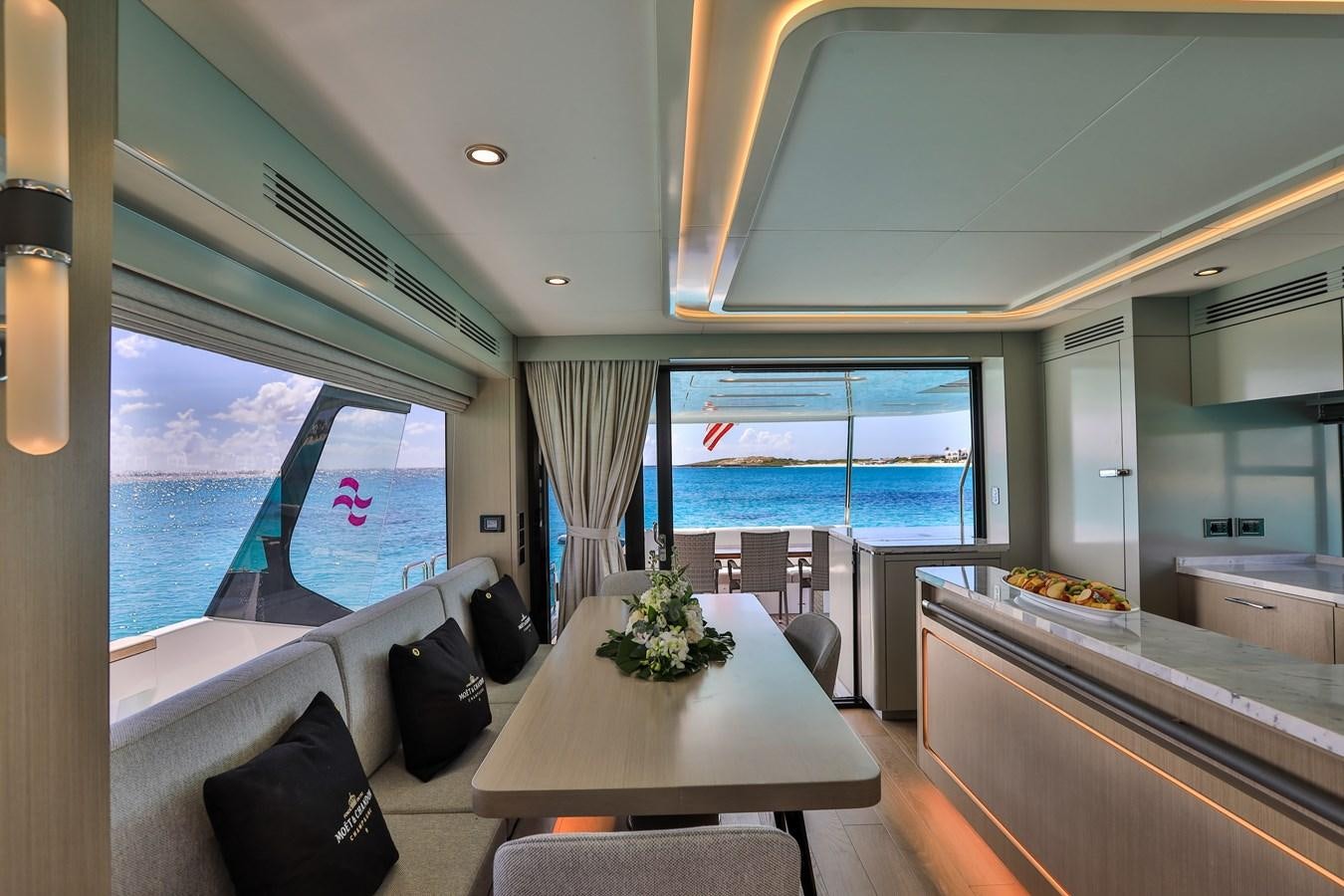 a room with a table and chairs aboard MY LADY Y Yacht for Sale