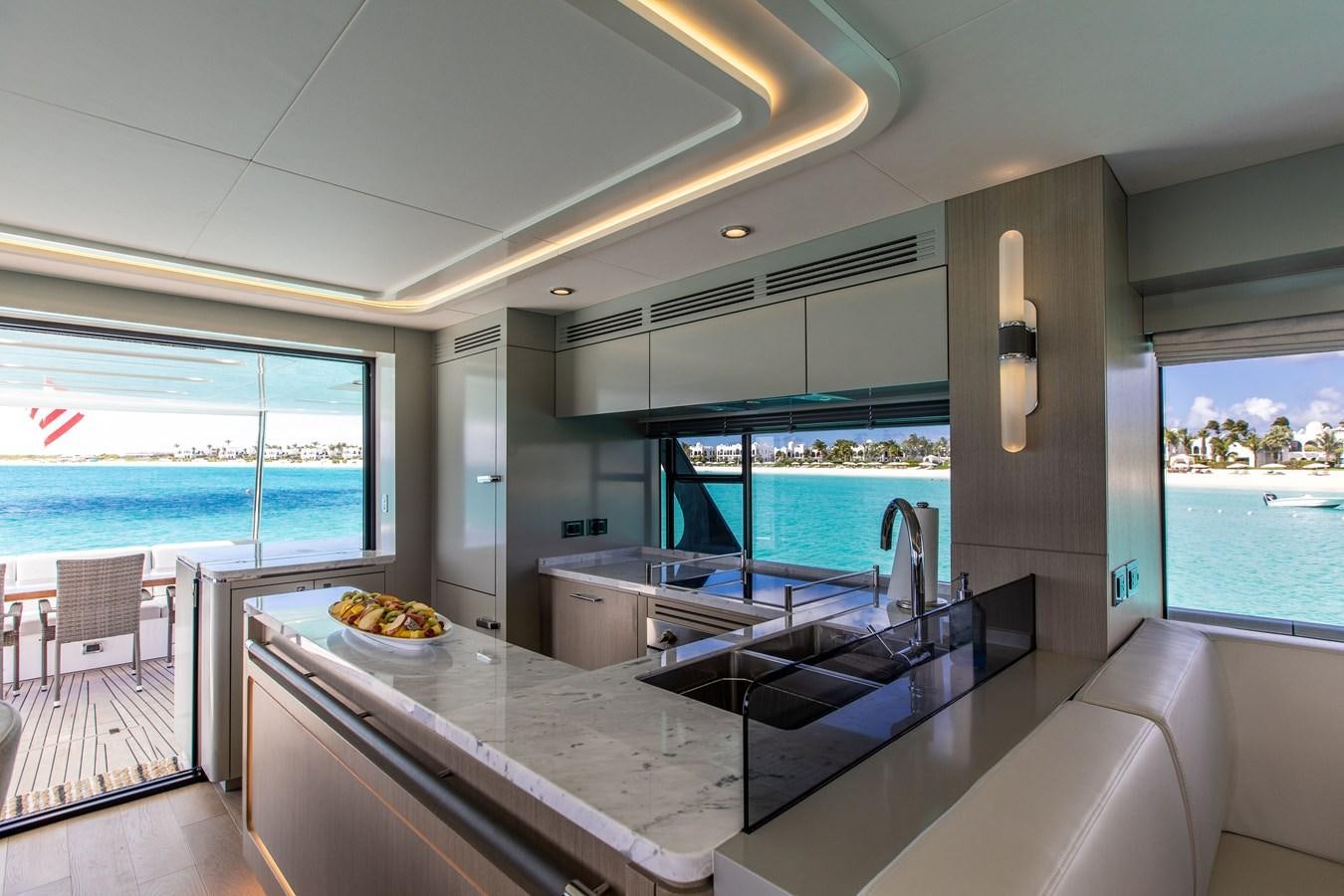 a modern kitchen with a large window aboard MY LADY Y Yacht for Sale