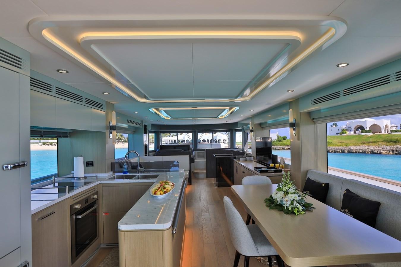 a kitchen with a large island aboard MY LADY Y Yacht for Sale