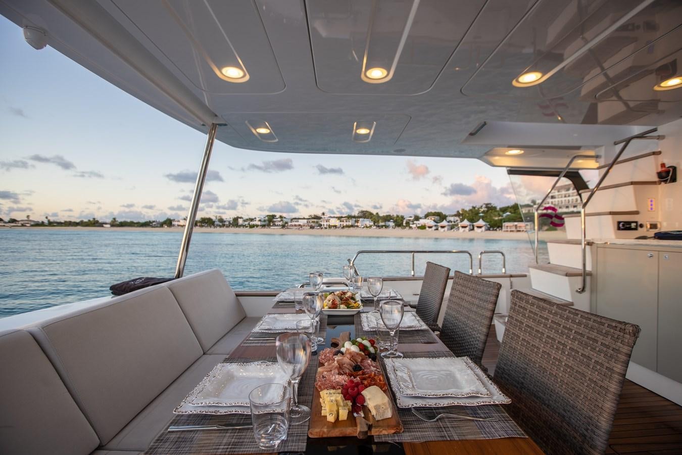 a table set for a meal on a boat aboard MY LADY Y Yacht for Sale