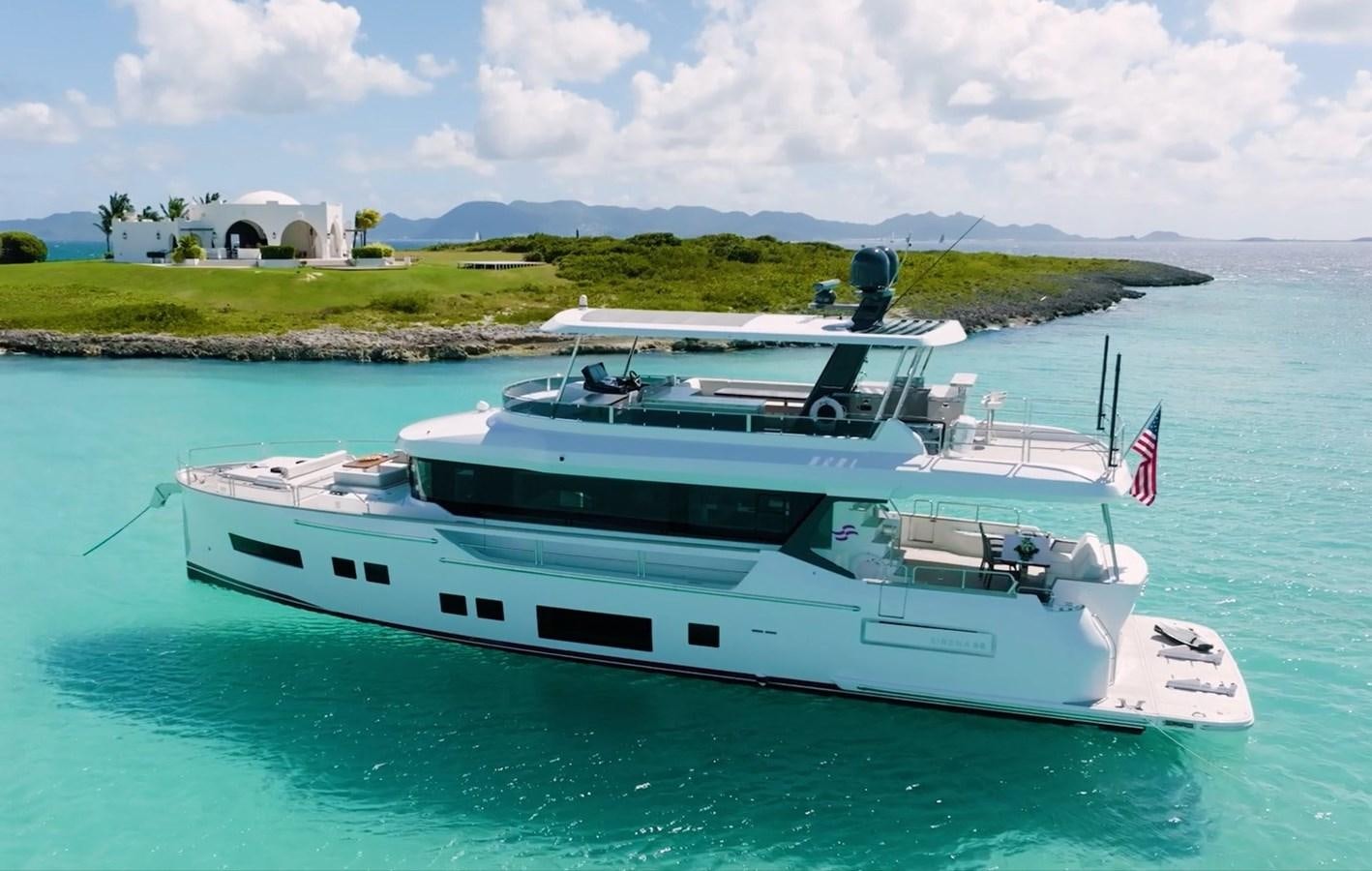 a white yacht on the water aboard MY LADY Y Yacht for Sale