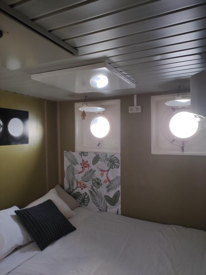 a bed with white sheets and pillows aboard TE STREEP Yacht for Sale