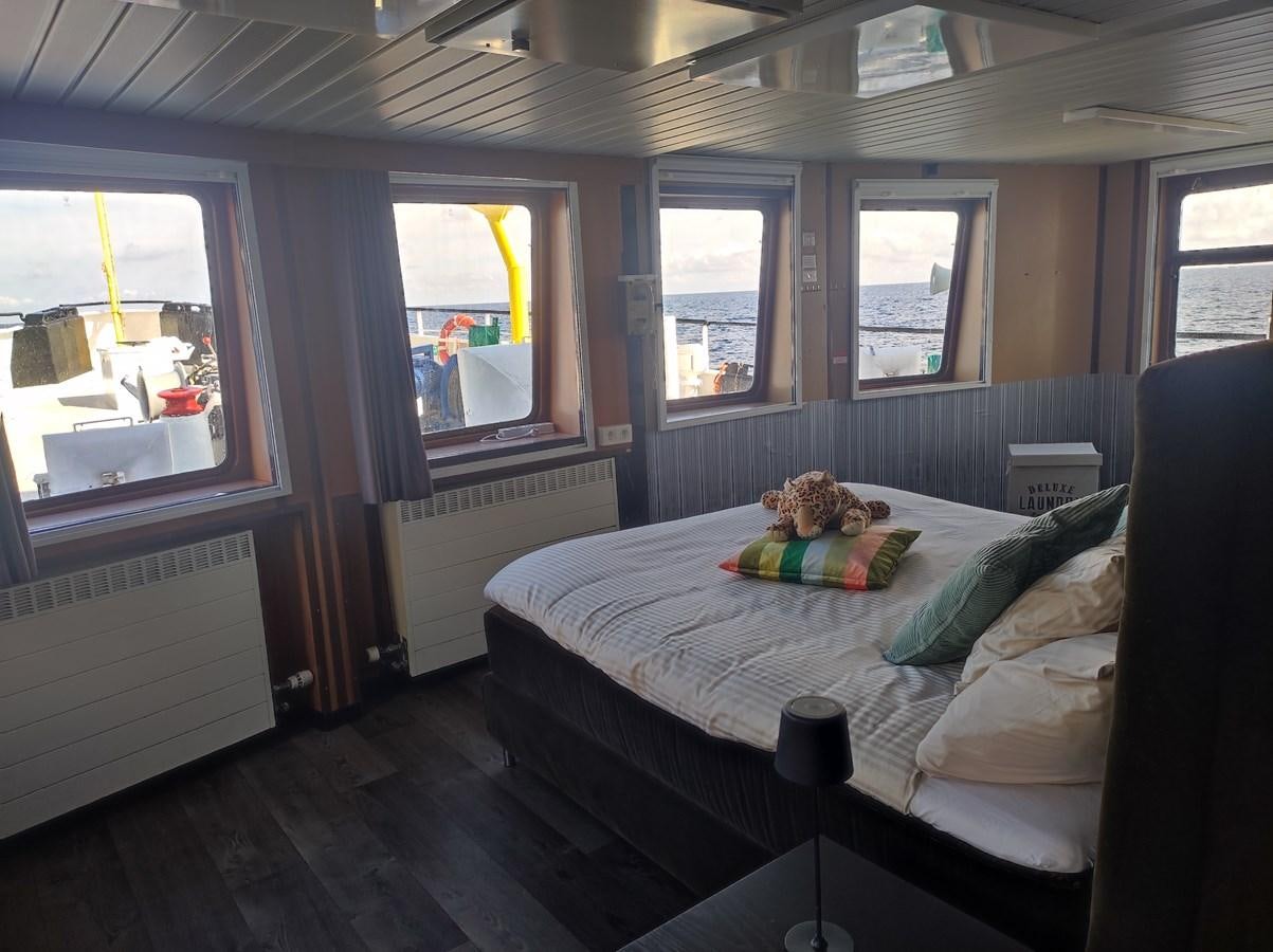 a small bedroom with a bed aboard TE STREEP Yacht for Sale