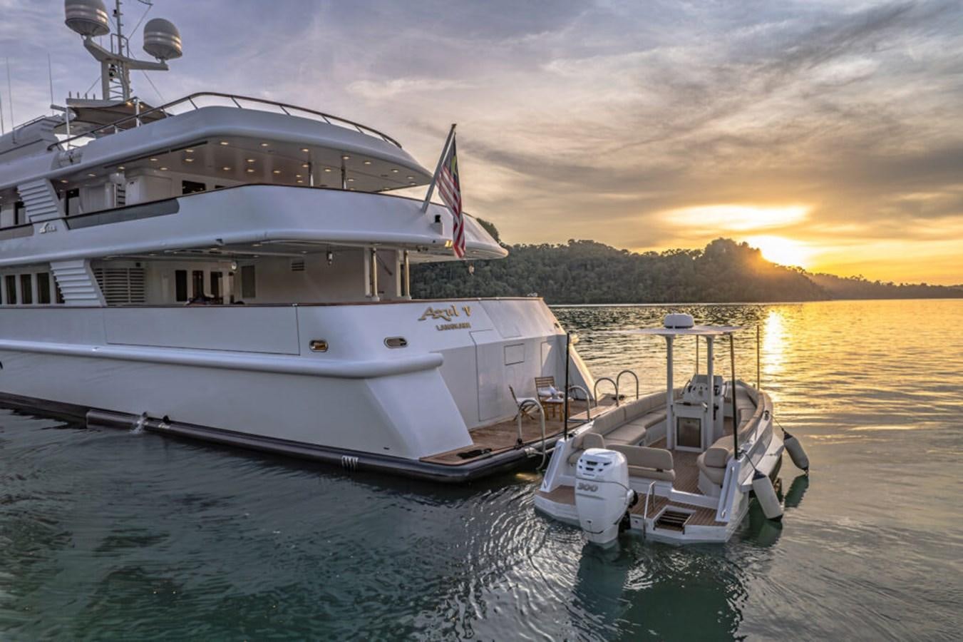 a couple of boats sit in the water aboard AZUL V Yacht for Sale