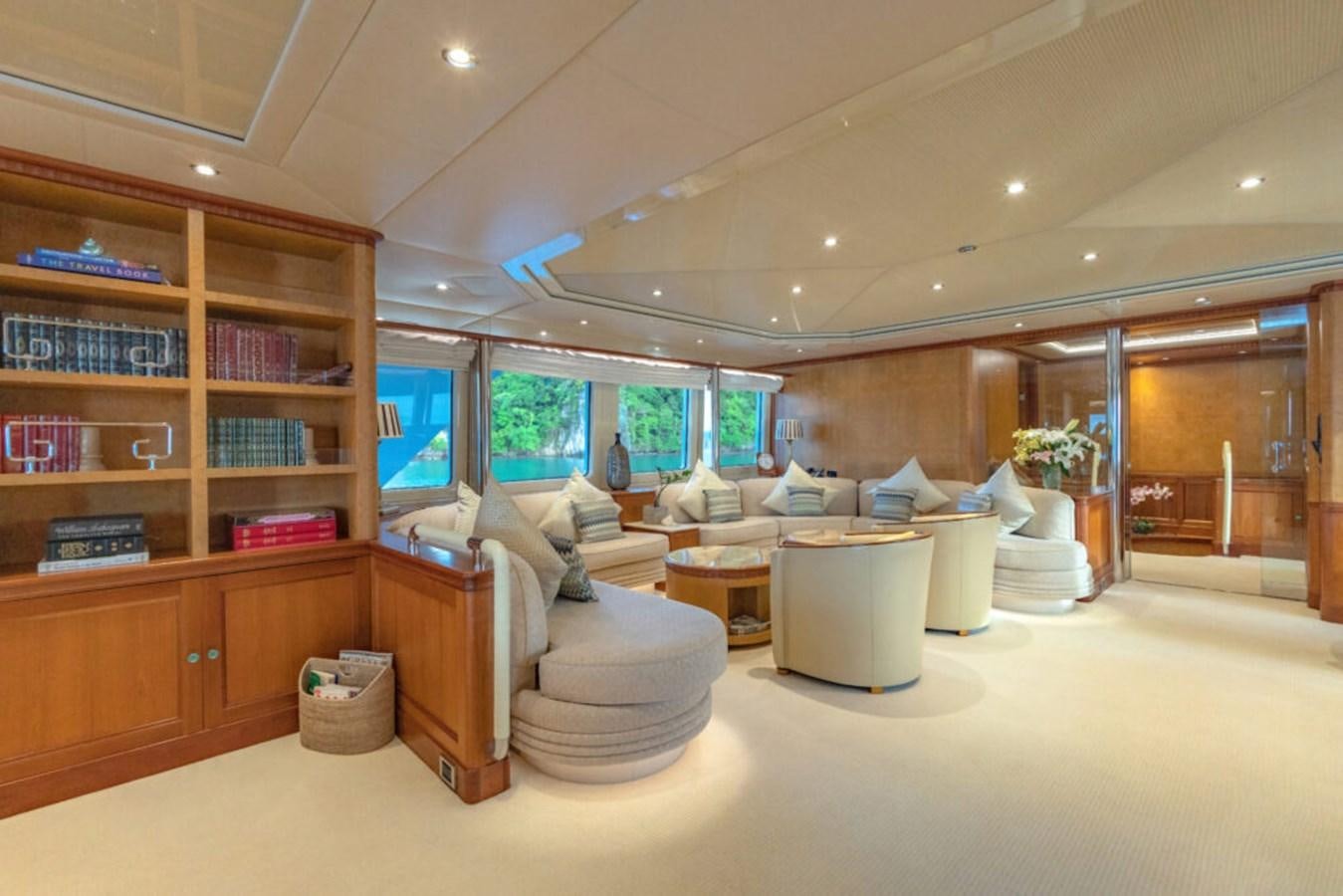 a room with a couch and a table aboard AZUL V Yacht for Sale