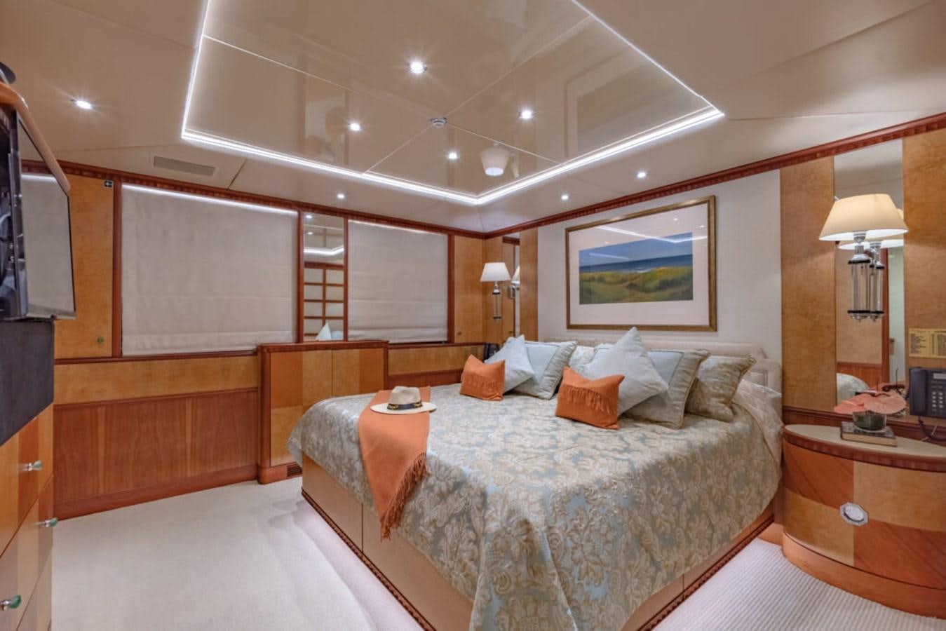 a bedroom with a bed and a desk aboard AZUL V Yacht for Sale