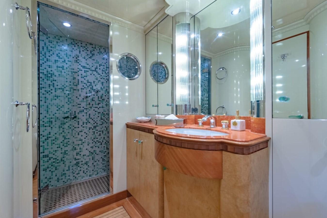 a bathroom with a sink and a shower aboard AZUL V Yacht for Sale