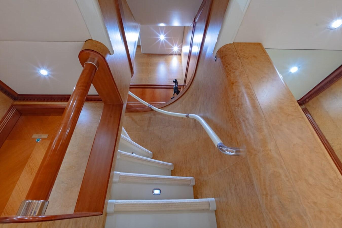 a staircase with a wood railing aboard AZUL V Yacht for Sale