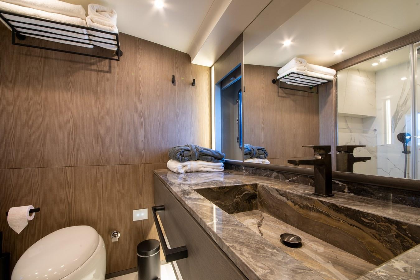 a bathroom with a sink and a mirror aboard PURA-VIDA Yacht for Sale