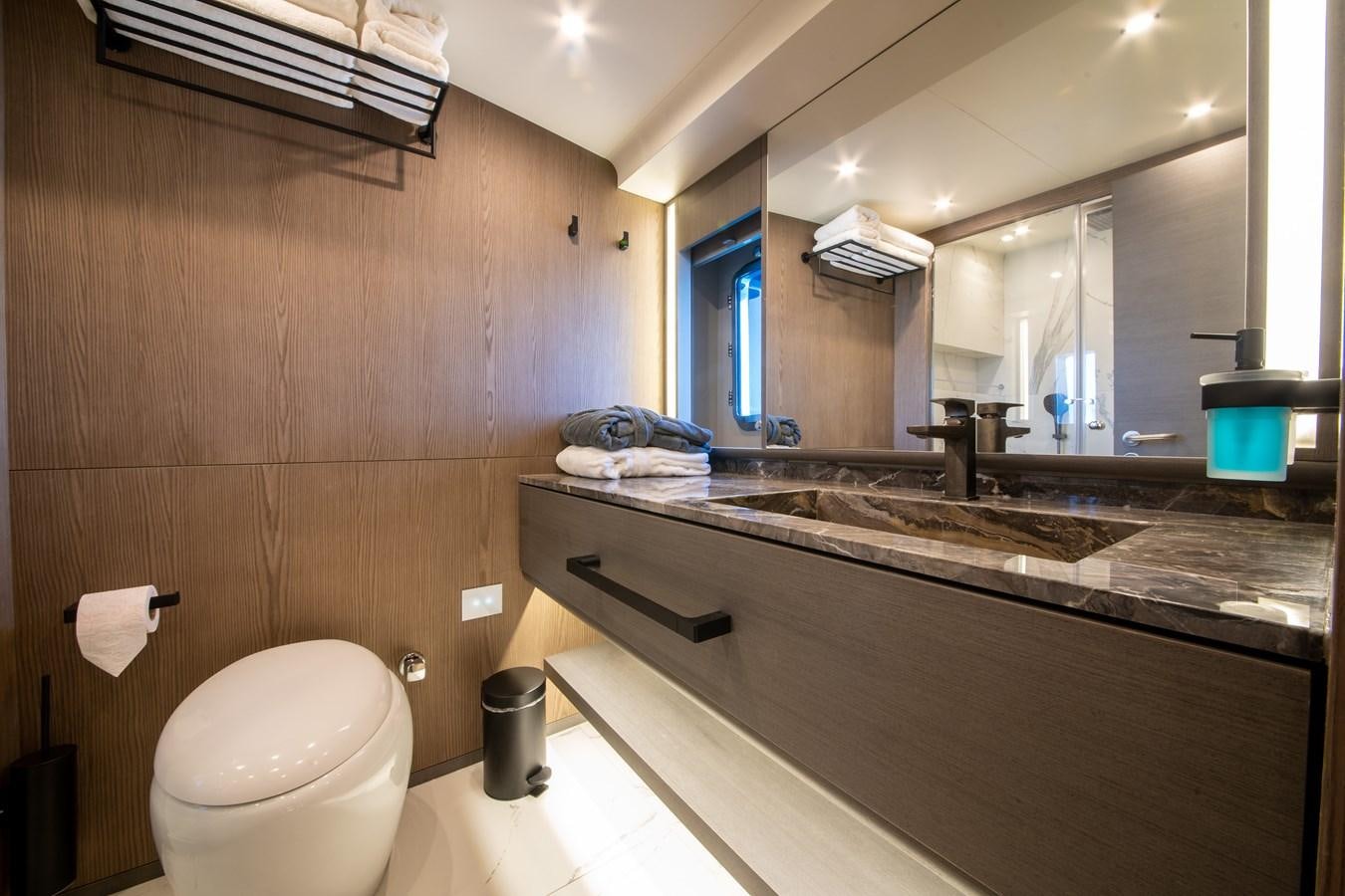 a bathroom with a sink and a toilet aboard PURA-VIDA Yacht for Sale