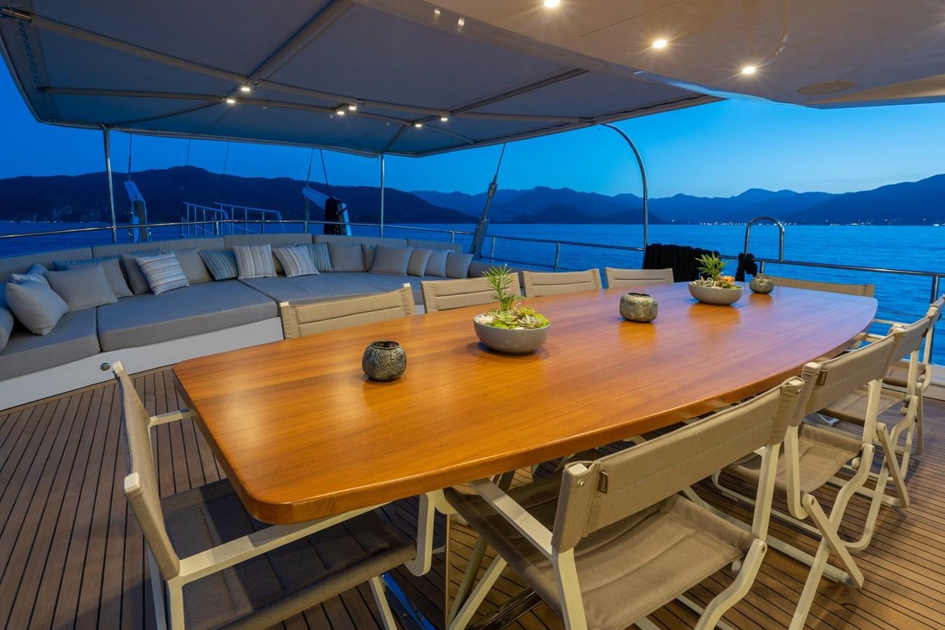 a table with chairs around it aboard PURA-VIDA Yacht for Sale