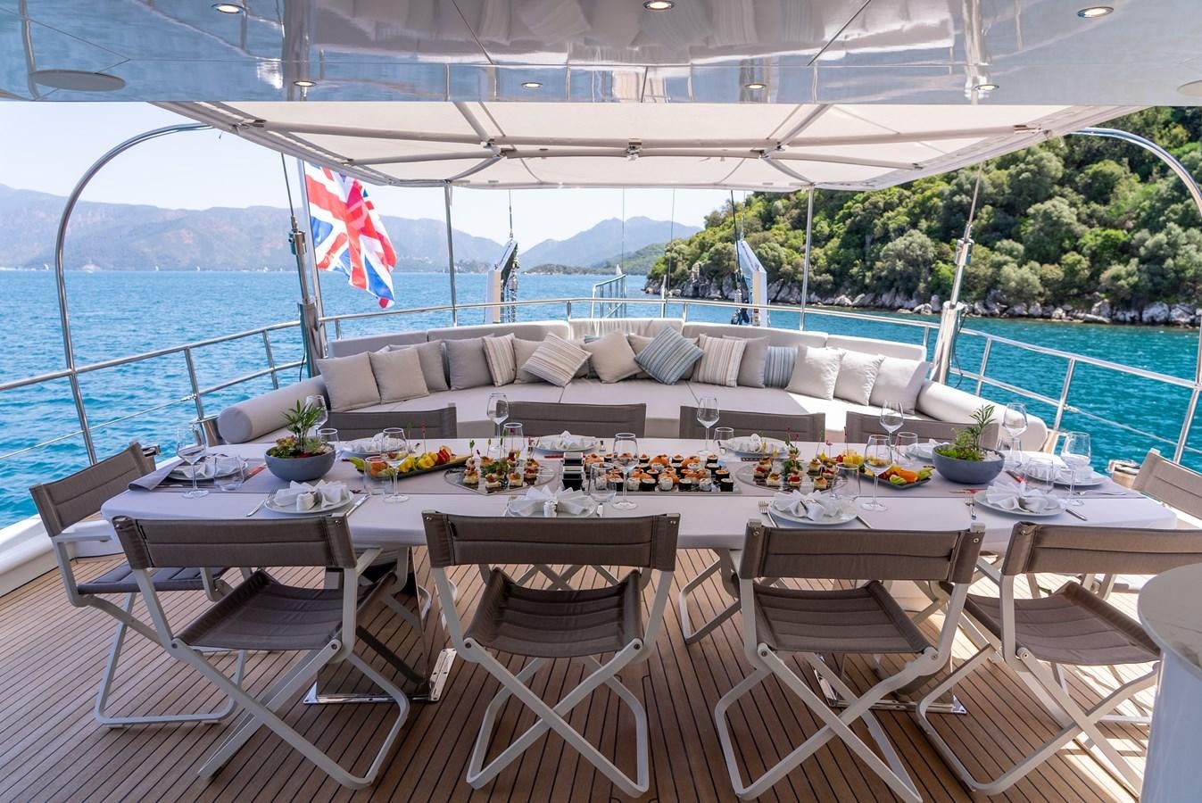 a table set for a meal on a boat aboard PURA-VIDA Yacht for Sale