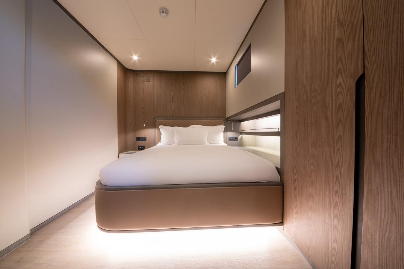 a bed in a room aboard PURA-VIDA Yacht for Sale