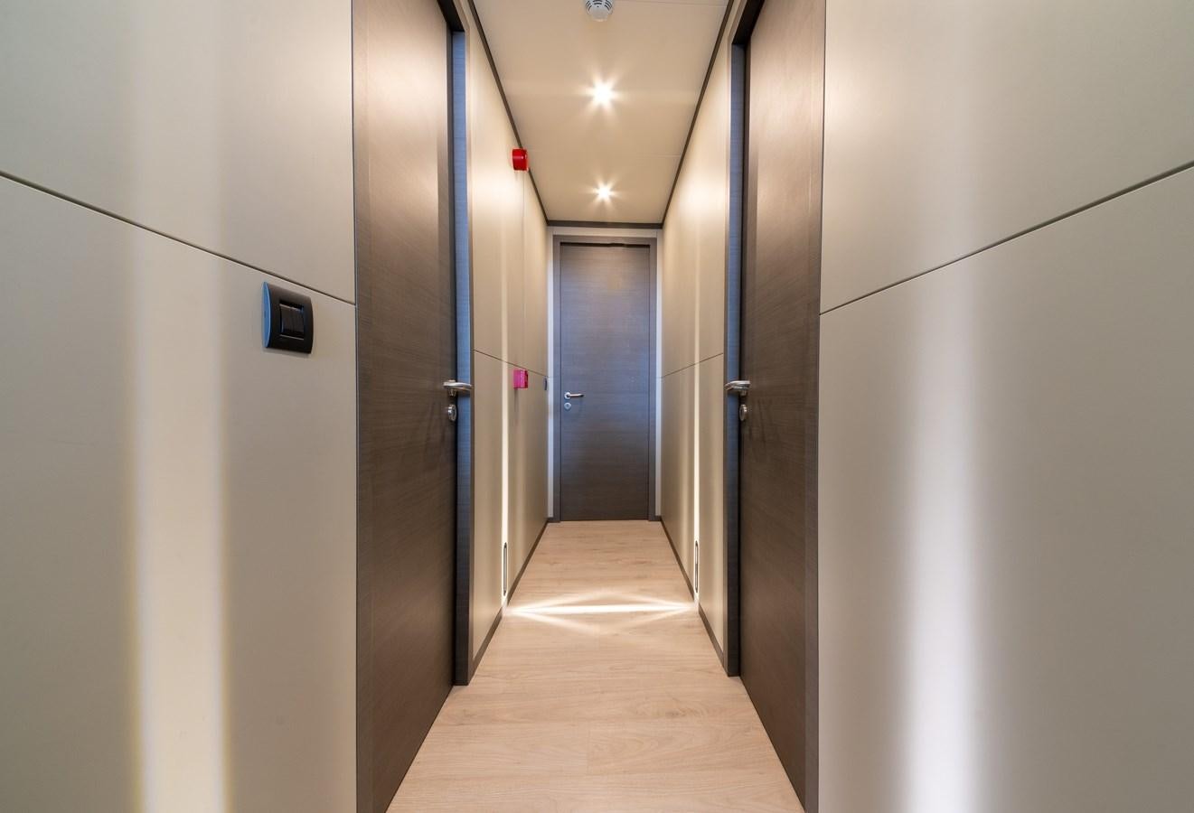 a hallway with doors aboard PURA-VIDA Yacht for Sale