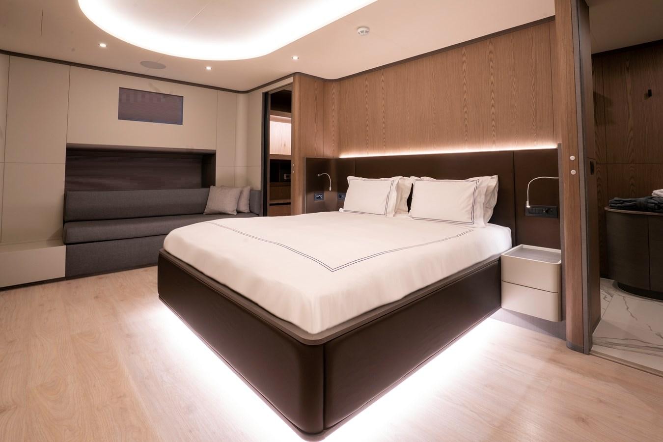 a large bed in a room aboard PURA-VIDA Yacht for Sale