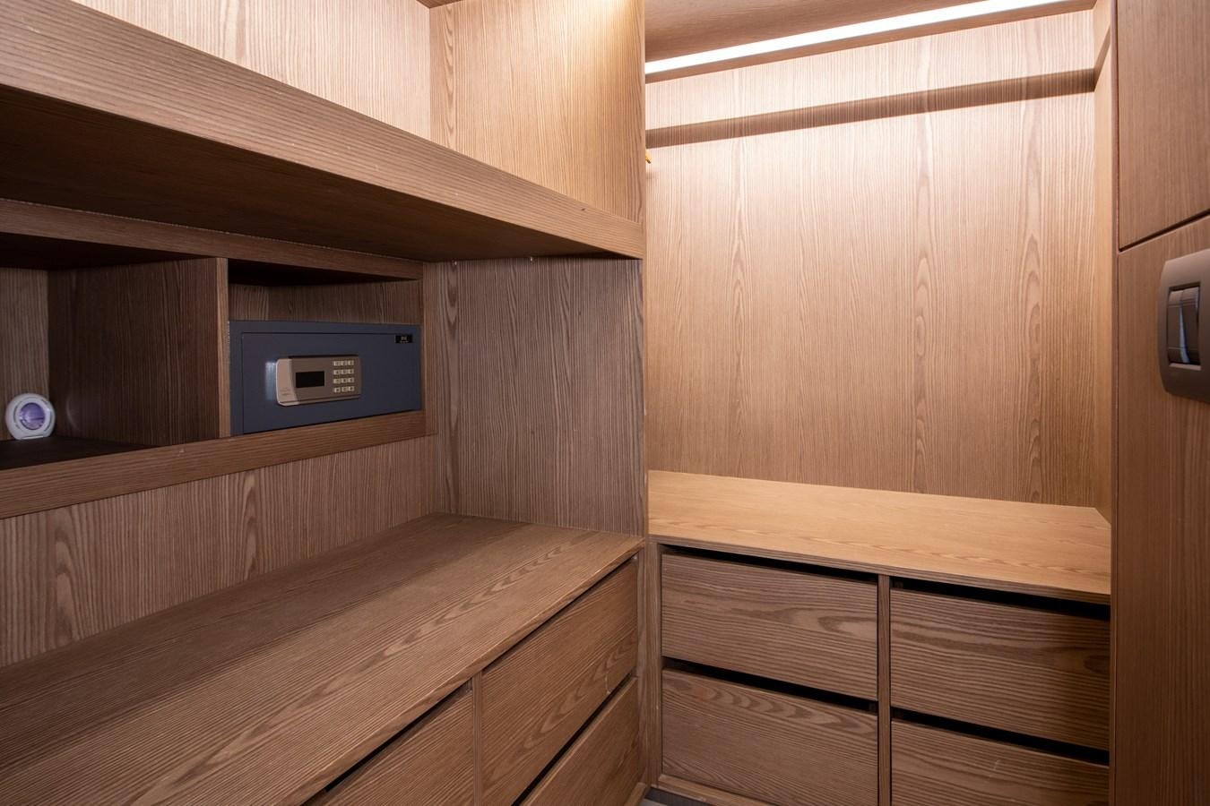 a wooden room with wooden furniture aboard PURA-VIDA Yacht for Sale