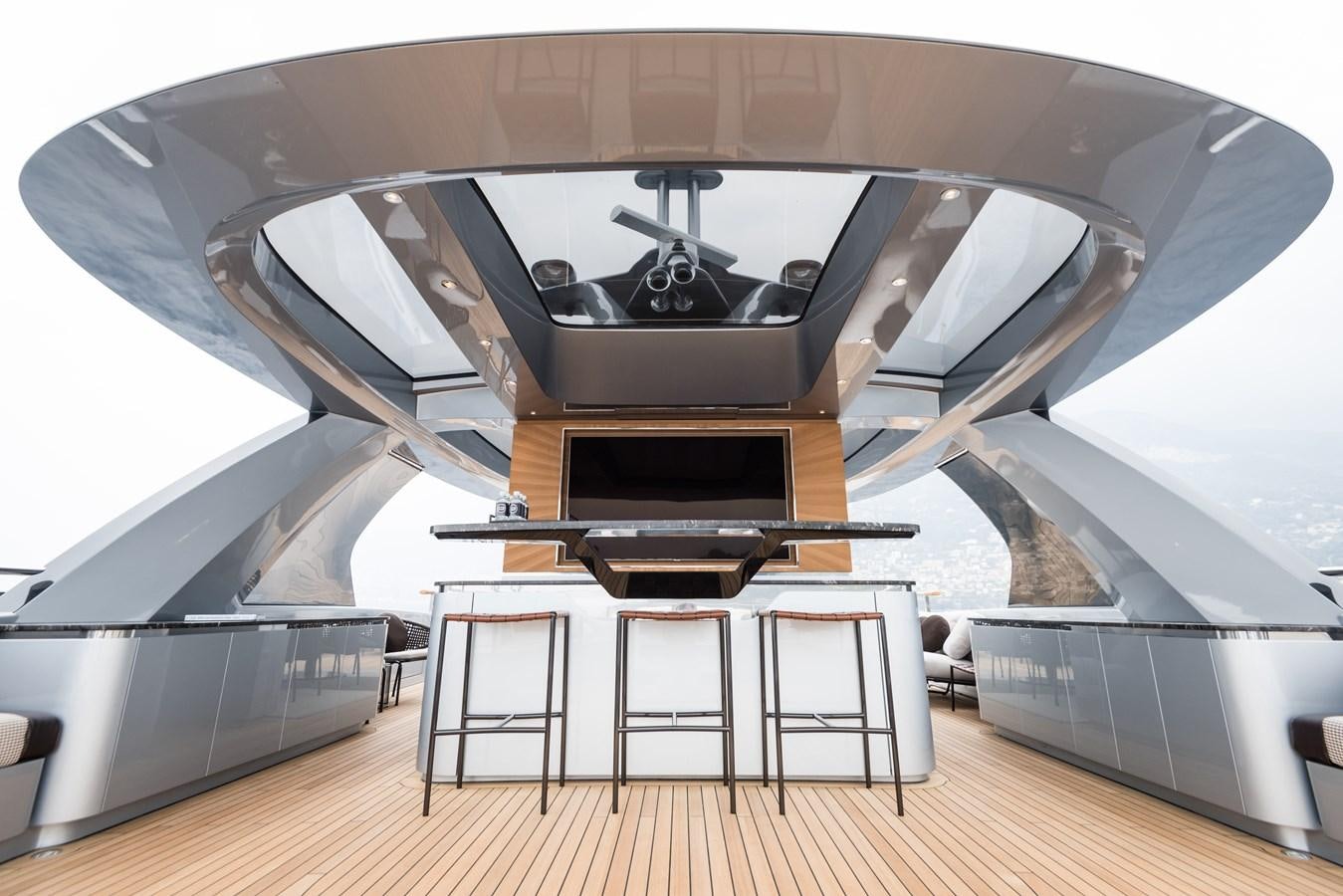 a room with a piano and stools aboard DYNAMIQ GTT 115  Yacht for Sale