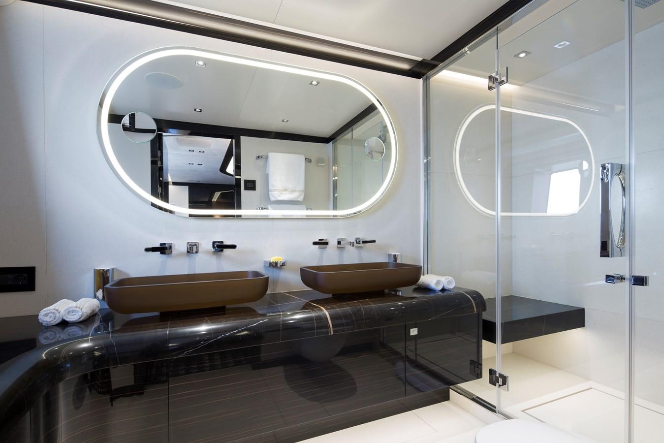 a bathroom with a large mirror aboard DYNAMIQ GTT 115  Yacht for Sale